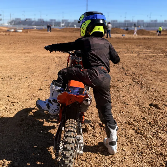 Kapakū on his KTM looking down the track