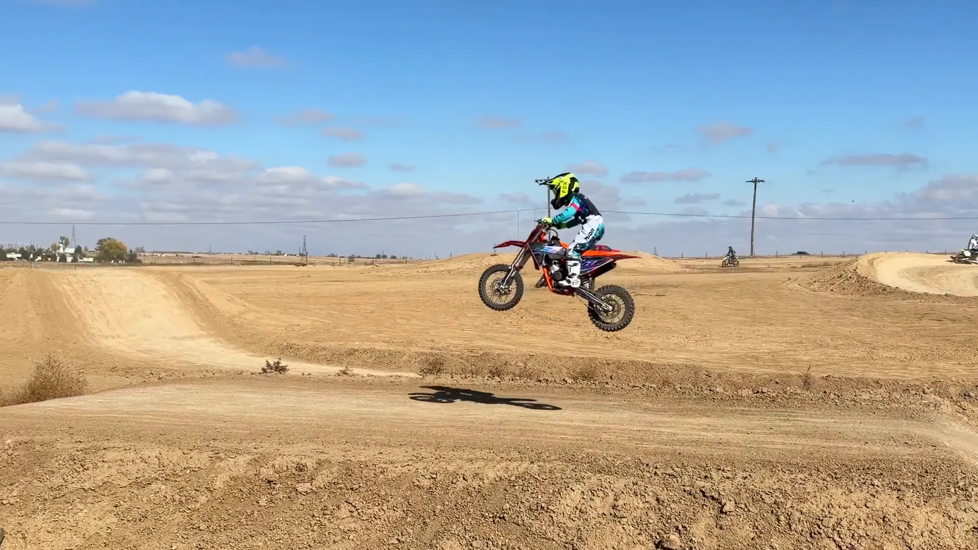 Kapakū clearing a table jump on his KTM 65SX